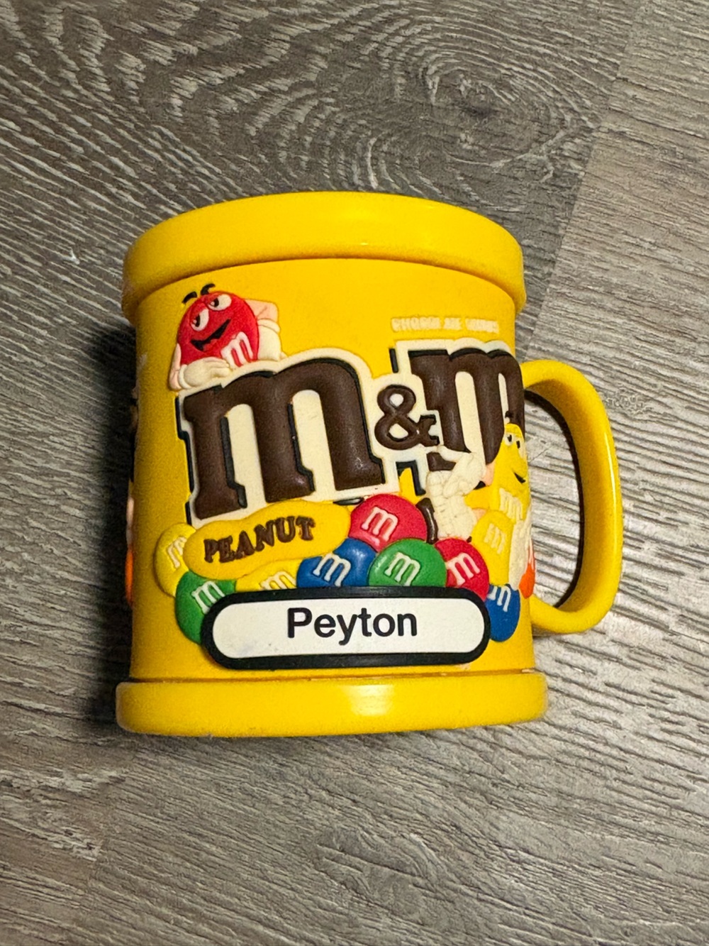 M&M'S Yellow Kids Mug with Multicolor Candy Graphics with name Peyton